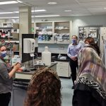 Sally describes lab research to FSHD visitors