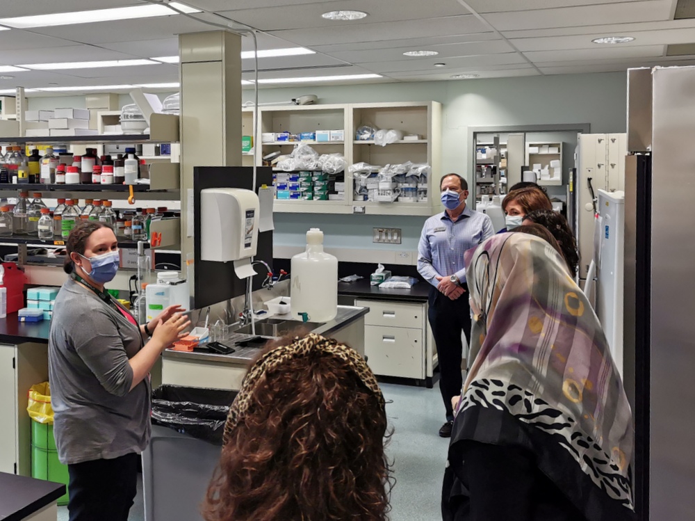 Sally describes lab research to FSHD visitors